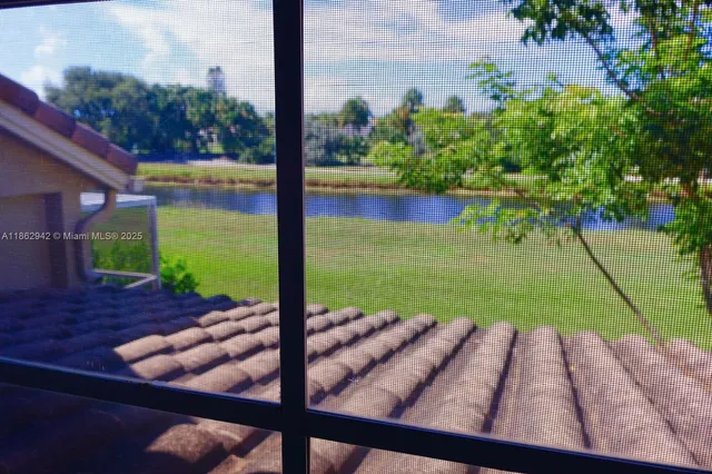 a view of a chairs and table in backyard
