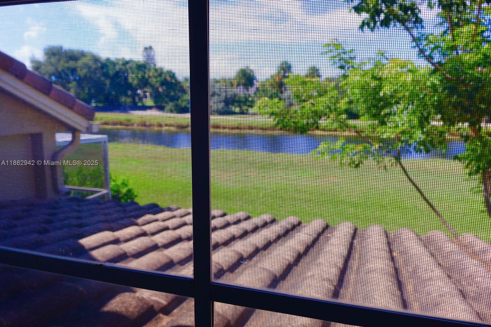 17246 Boca Club Boulevard, Unit 102 Boca Raton, FL 33487 - Photo 47 of 50 a view of a yard with an outdoor space