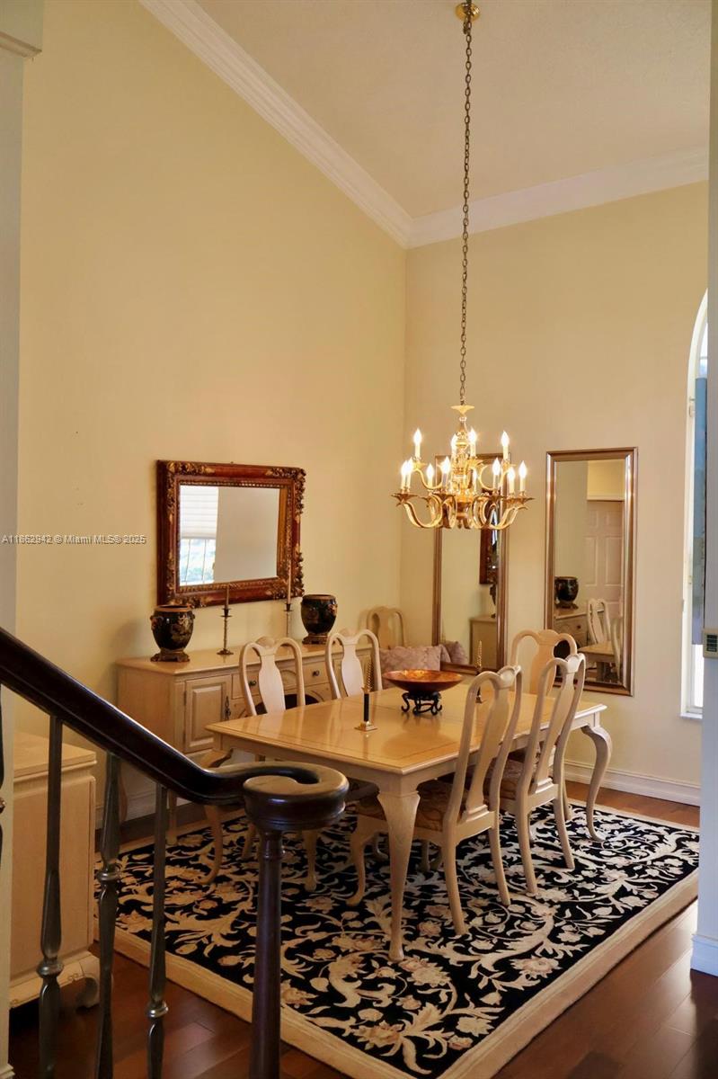 17246 Boca Club Boulevard, Unit 102 Boca Raton, FL 33487 - Photo 6 of 50 a dining room with furniture and wooden floor