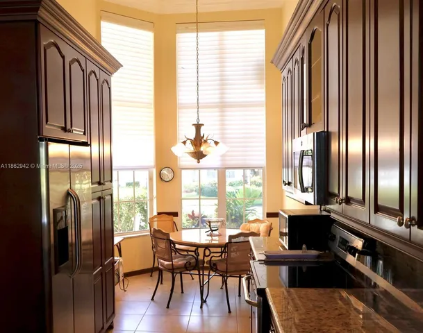 a view of a dining room with furniture and a window