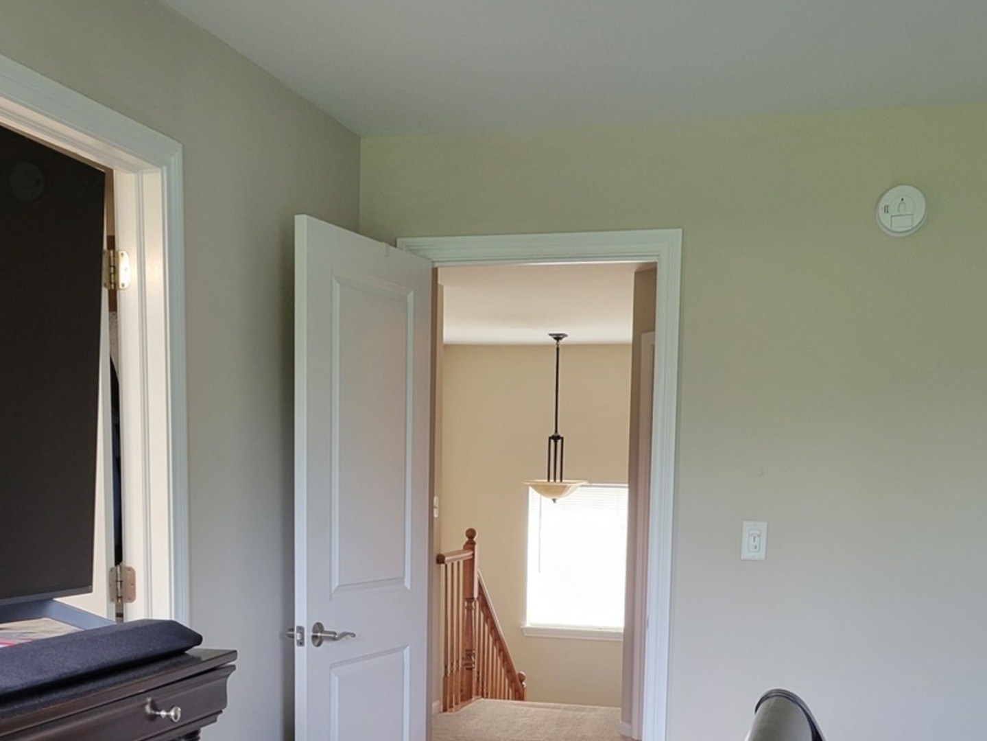 2475 Waterbury Lane Buffalo Grove, IL 60089 - Photo 17 of 19 a view of a hallway with a mirror and a window