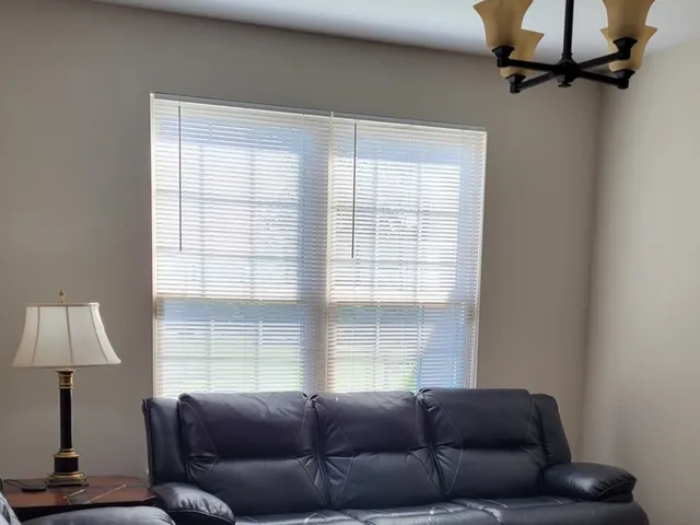 a living room with furniture and a window