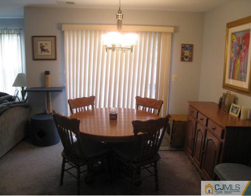 1419 Plymouth Road North Brunswick, NJ 08902 - Photo 5 of 9 a view of a dining room with furniture and window