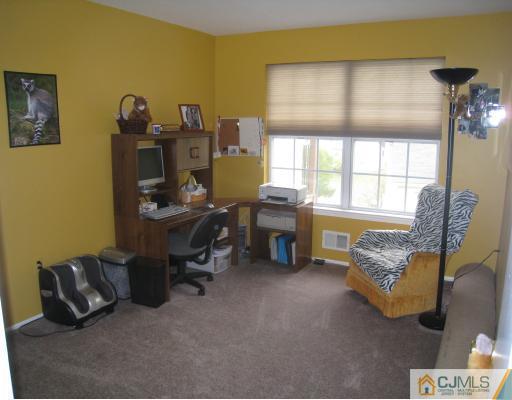 1419 Plymouth Road North Brunswick, NJ 08902 - Photo 9 of 9 a workspace with furniture and a window