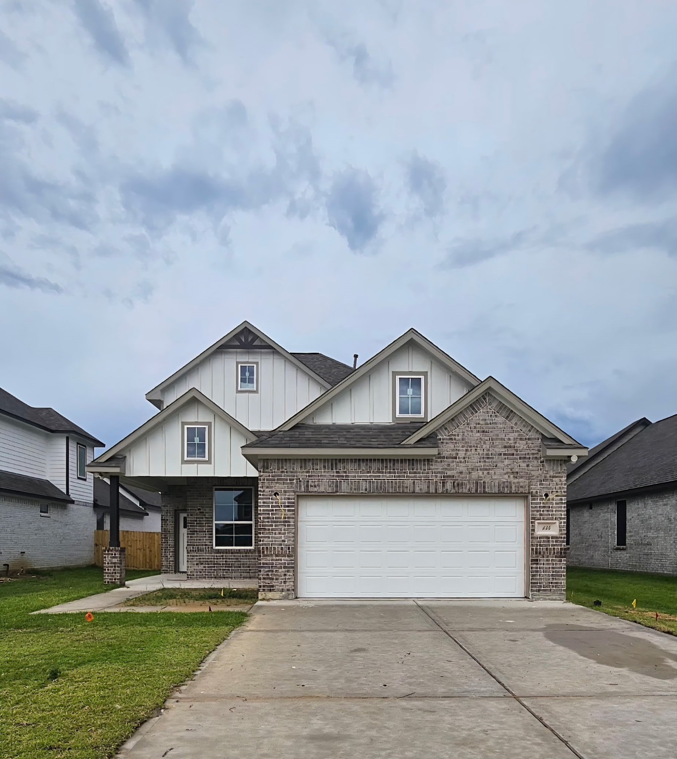 134 Peachleaf Court Anahuac, TX 77514 - Photo 1 of 7 a front view of a house with a garden and yard