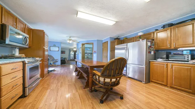 a bed room with a bed window and a chair