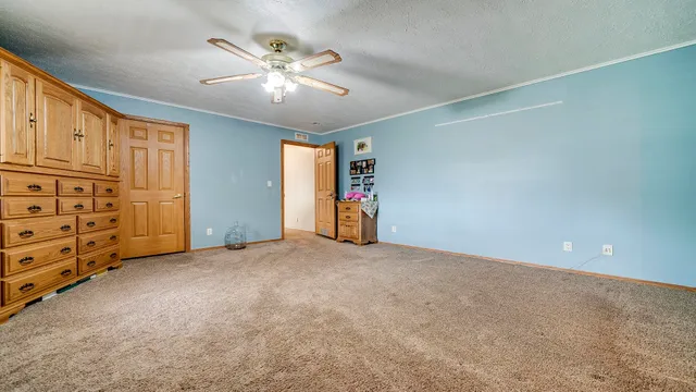 a large room with lots of furniture and a chandelier