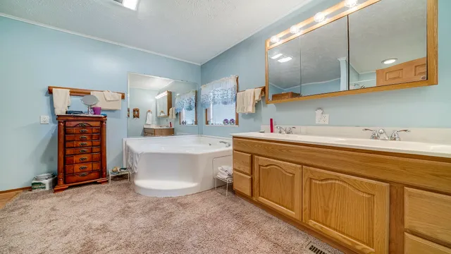 a living room with lots of furniture and a chandelier