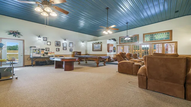 a view of a house with backyard and porch