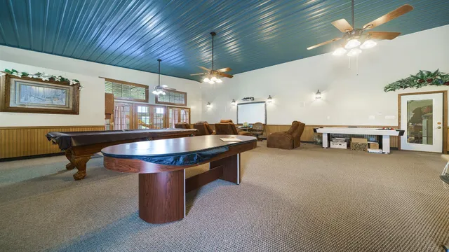 a view of a porch with wooden floor and plants