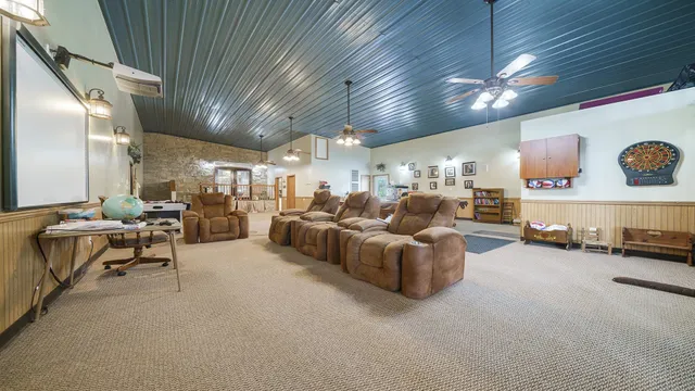 a view of a house with a yard and sitting area