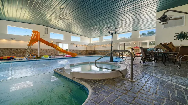 a picture of a bathroom with a shower and a bath tub