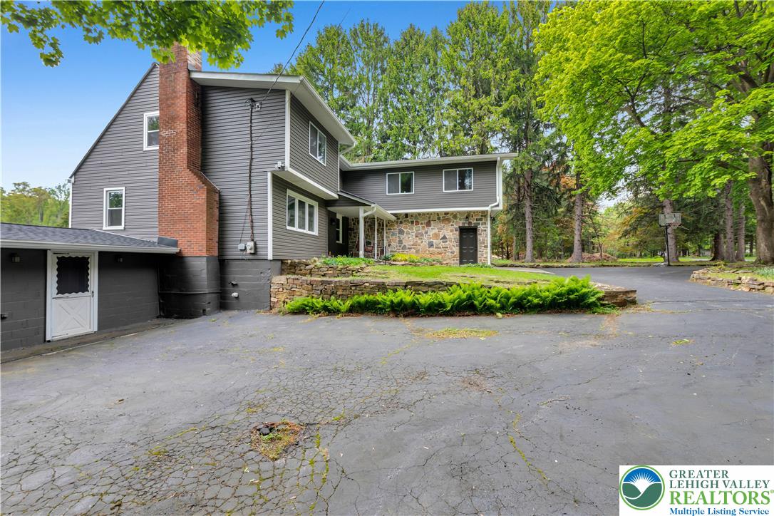 2242 Church Road Bethlehem, PA 18015 - Photo 6 of 74 a front view of a house with a yard and garage