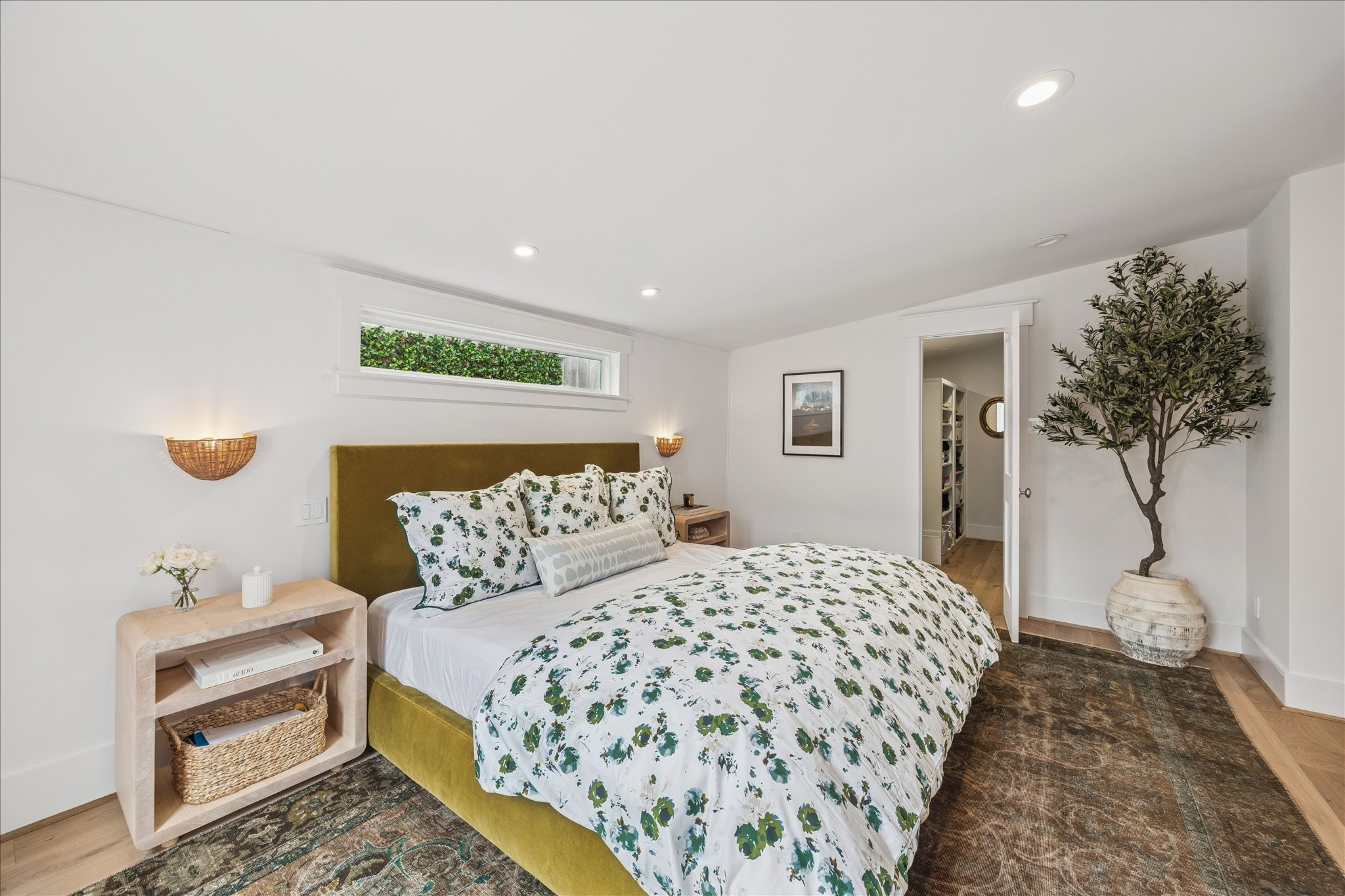 823 Sledge Street Houston, TX 77009 - Photo 14 of 24 a bedroom with a bed and a potted plant