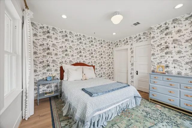 a living room with furniture and book shelf