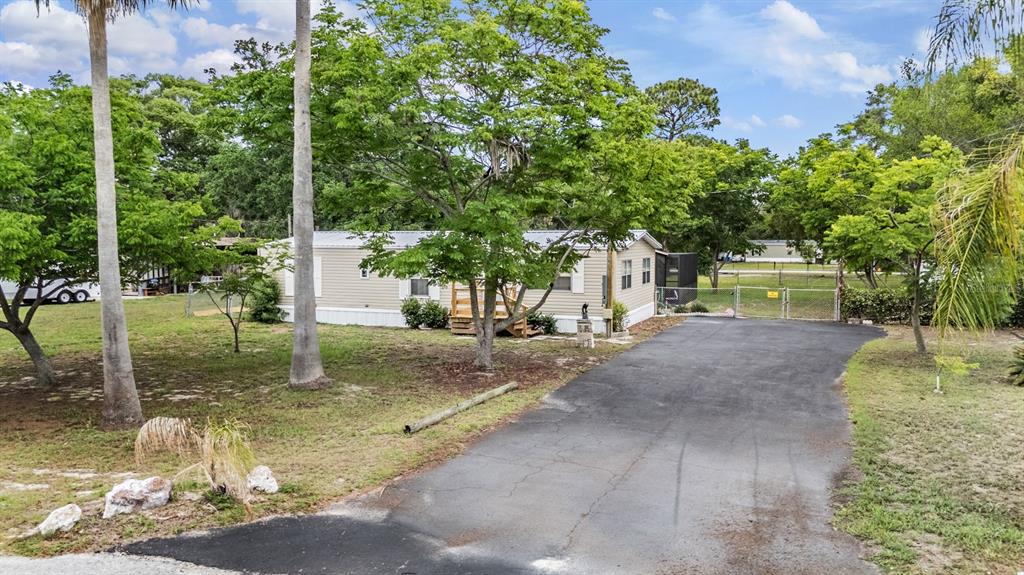 9739 Ray Street Hudson, FL 34669 - Photo 3 of 36 a view of a park with trees