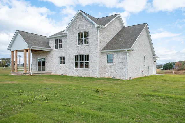 a big house with a big yard and more windows