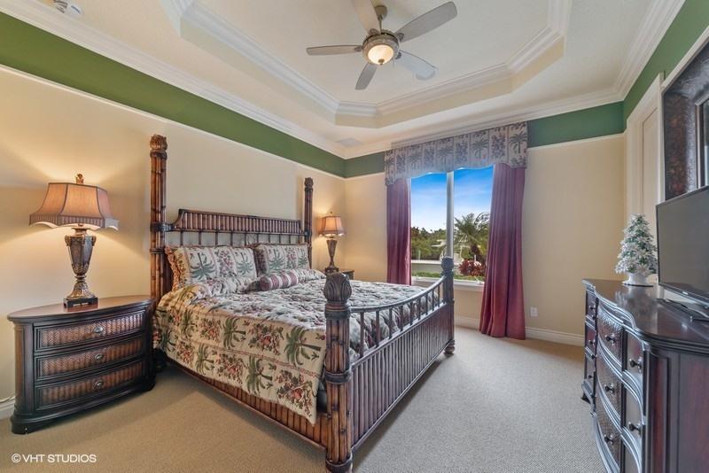 16904 Passage South Jupiter, FL 33477 - Photo 15 of 22 a bedroom with a bed and a flat tv screen