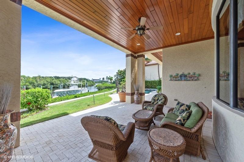 16904 Passage South Jupiter, FL 33477 - Photo 16 of 22 a outdoor living space with furniture and garden view