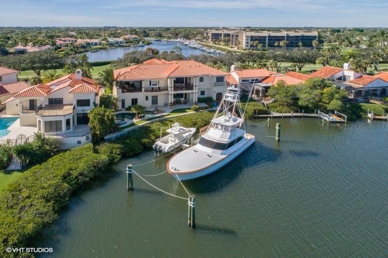 16904 Passage South Jupiter, FL 33477 - Photo 21 of 22 an aerial view of a house with swimming pool patio and lake view