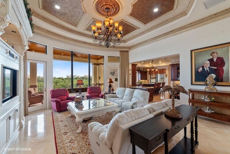 16904 Passage South Jupiter, FL 33477 - Photo 5 of 22 a living room with patio furniture and a chandelier