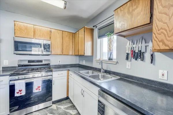 a kitchen with a stove and a sink