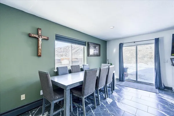 a view of a dining room with furniture window and outside view