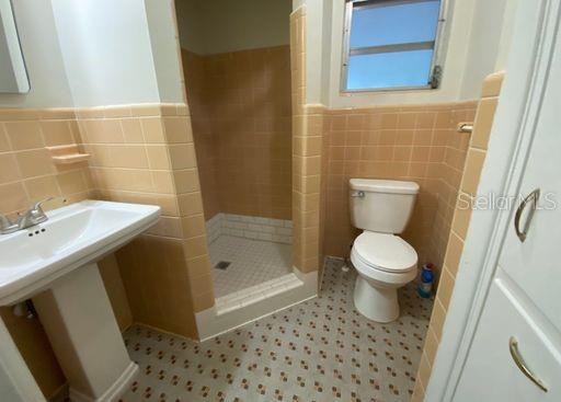 930 Northwest 36th Avenue Gainesville, FL 32609 - Photo 5 of 9 a bathroom with a toilet and a sink