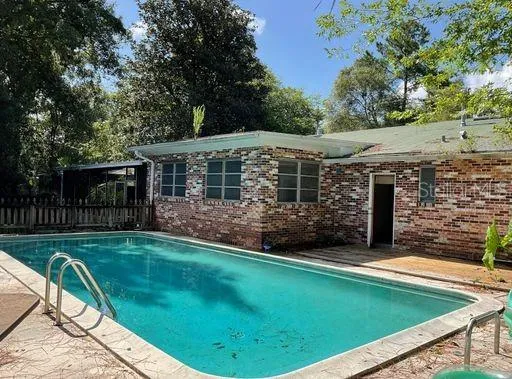 a view of a house with backyard and porch