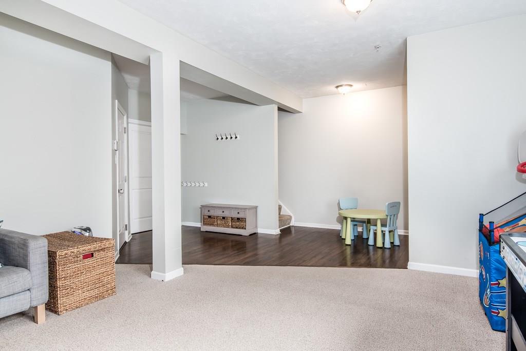 133 Shenot Road Wexford, PA 15090 - Photo 22 of 25 Finished lower level game room with hard surface entry and shoe/coat storage. The laundry area is convienent located through the door to the left.