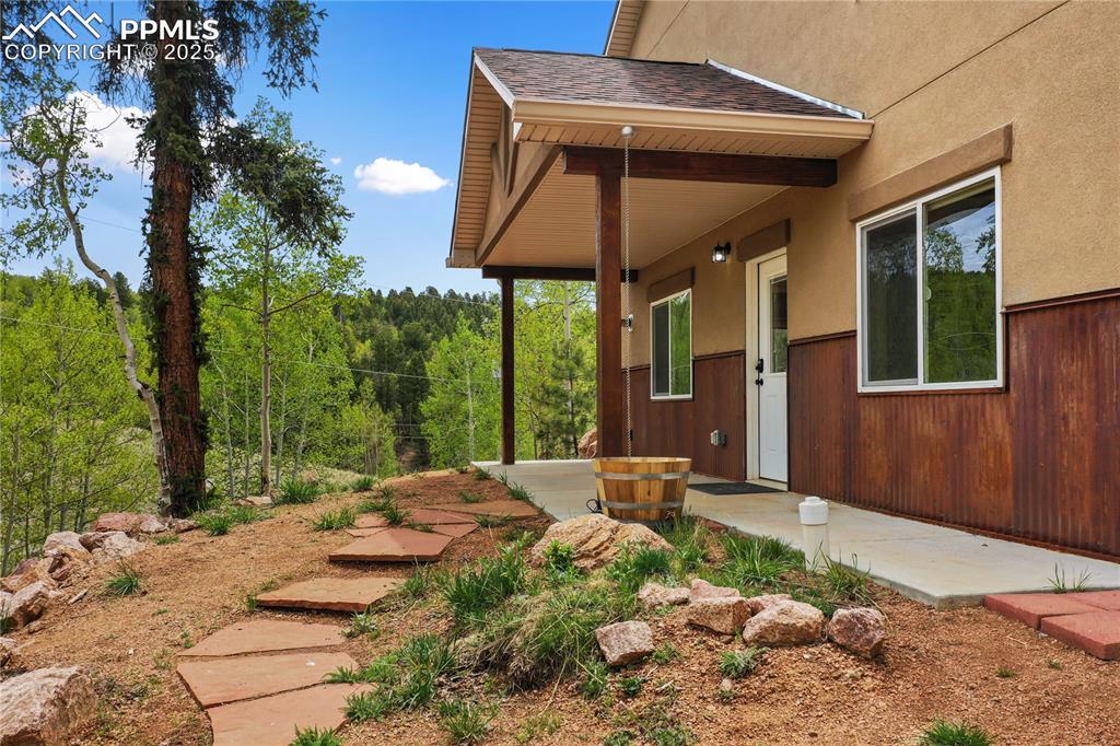 621 Yorktown Road Cripple Creek, CO 80813 - Photo 2 of 29 View of yard with a view of trees