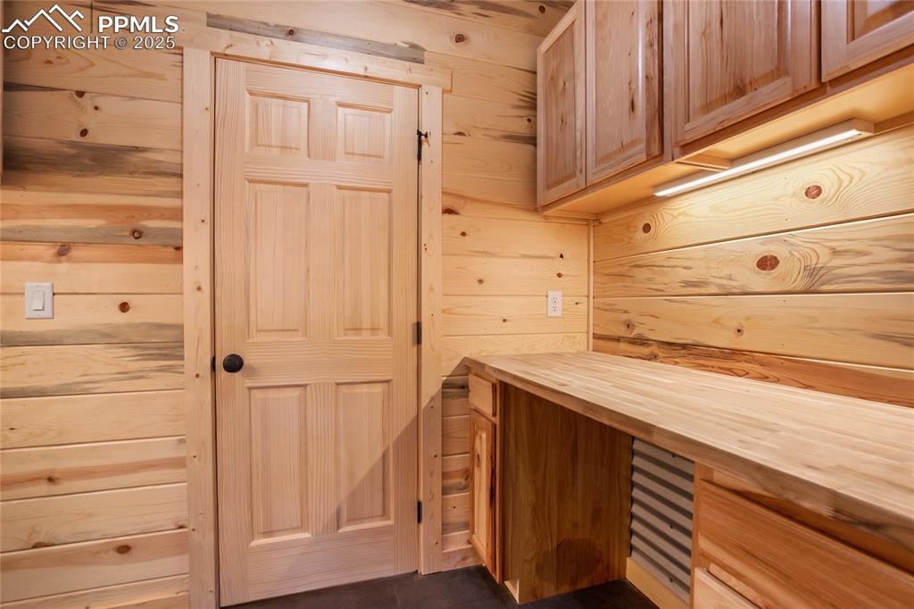 621 Yorktown Road Cripple Creek, CO 80813 - Photo 22 of 29 Laundry room with extra storage and counter to fold clothes on