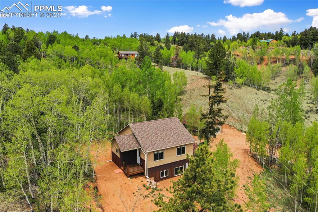 621 Yorktown Road Cripple Creek, CO 80813 - Photo 6 of 29 View from above of property with a heavily wooded area