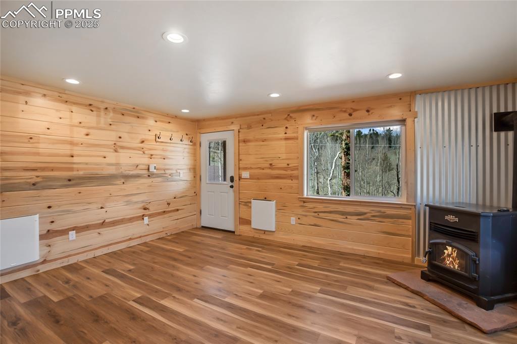621 Yorktown Road Cripple Creek, CO 80813 - Photo 7 of 29 Living room with electric pellet stove that heats the entire house with ease