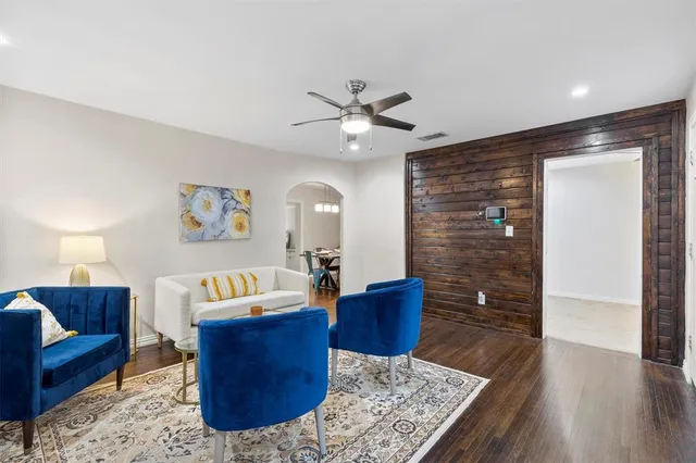 a living room with couch cabinet and a rug