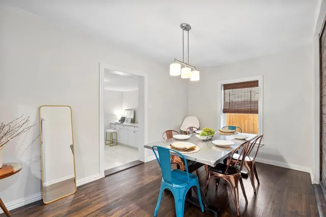 a view of a dining room and a table chairs