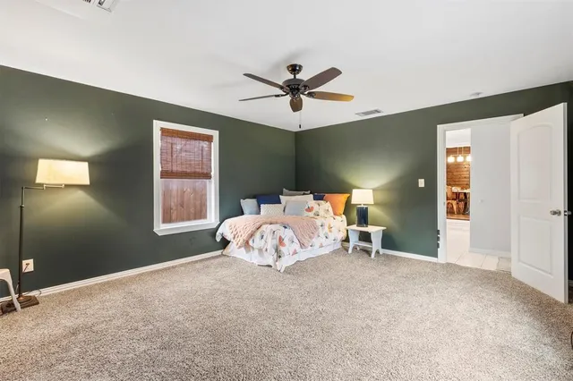 a bed room with a bed and a window