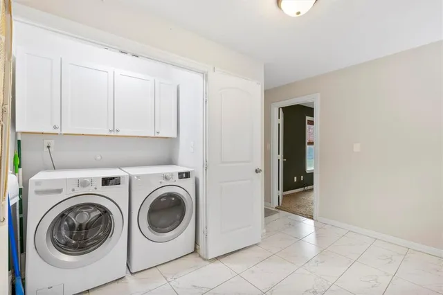 a view of a storage & utility room with washer and dryer