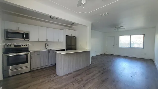a kitchen with appliances and cabinets
