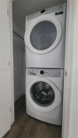 a bathroom with a toilet a sink a mirror and vanity