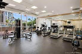 8855 Collins Avenue, Unit 9E Surfside, FL 33154 - Photo 7 of 9 a view of a room with gym equipment