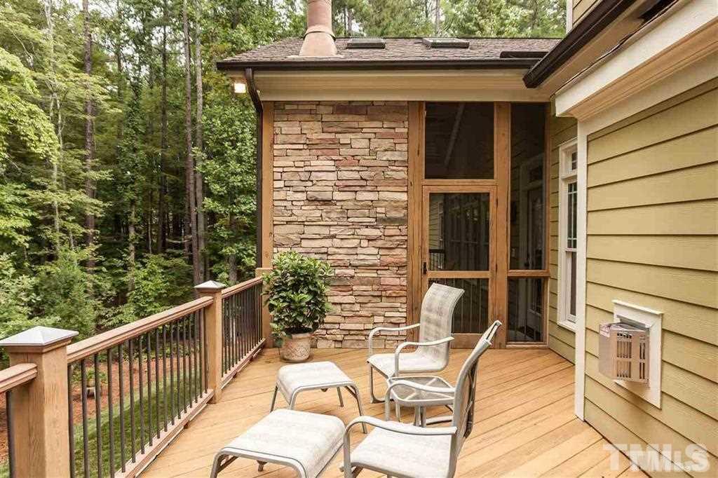 5515 Strathmore Drive Raleigh, NC 27613 - Photo 22 of 25 a balcony with table and chairs