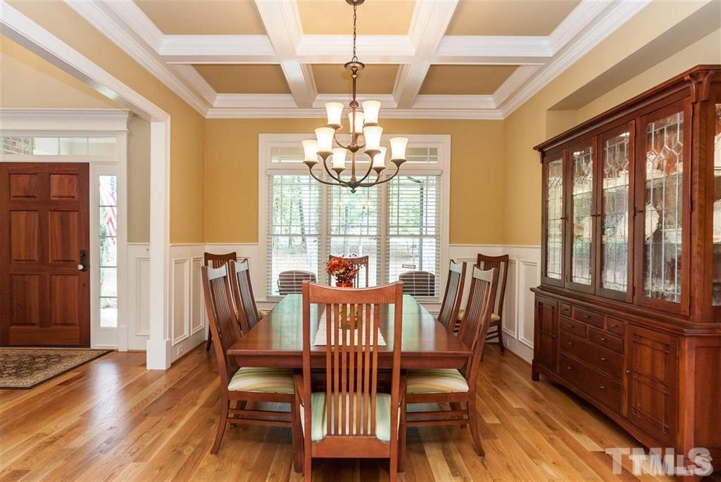 5515 Strathmore Drive Raleigh, NC 27613 - Photo 4 of 25 a view of a dining room with furniture window and wooden floor