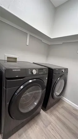 a utility room with washing machine