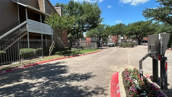 a view of a backyard with sitting area