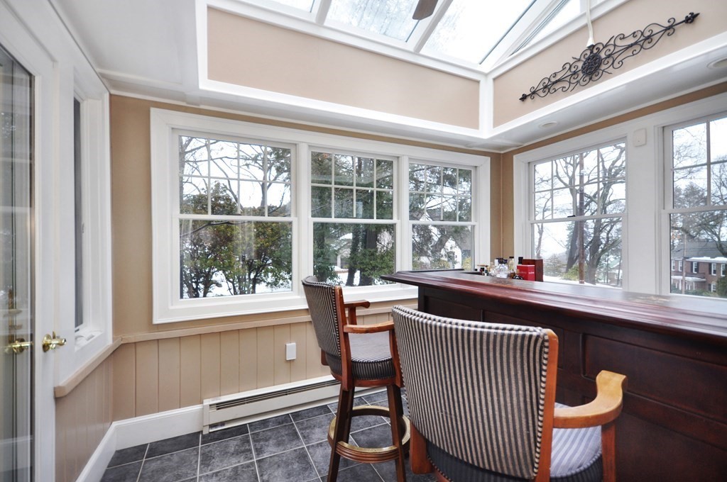 75 Winchester Road Arlington, MA 02474 - Photo 21 of 42 a room with wooden floor and windows