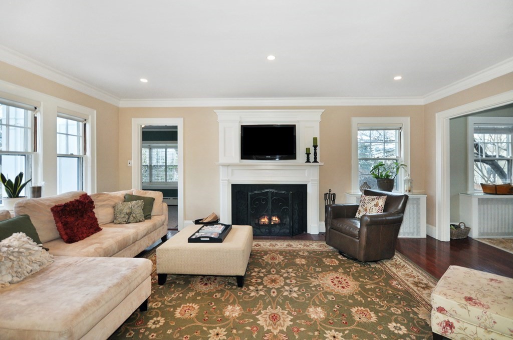 75 Winchester Road Arlington, MA 02474 - Photo 5 of 42 a living room with furniture and a fireplace