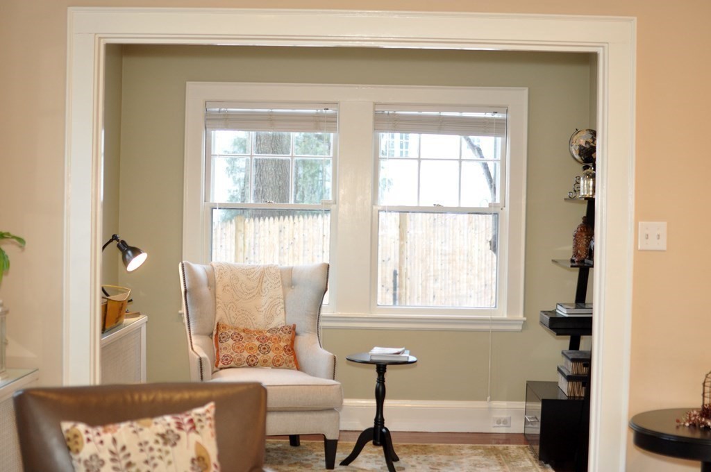 75 Winchester Road Arlington, MA 02474 - Photo 8 of 42 a living room with furniture and a window