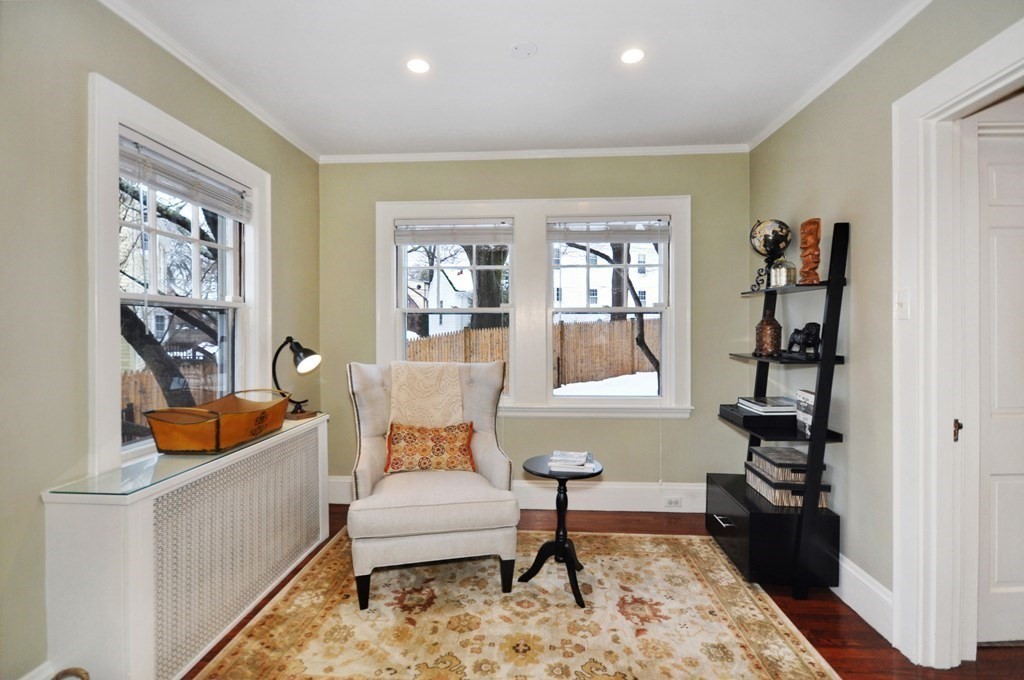 75 Winchester Road Arlington, MA 02474 - Photo 9 of 42 a living room with furniture and a book shelf