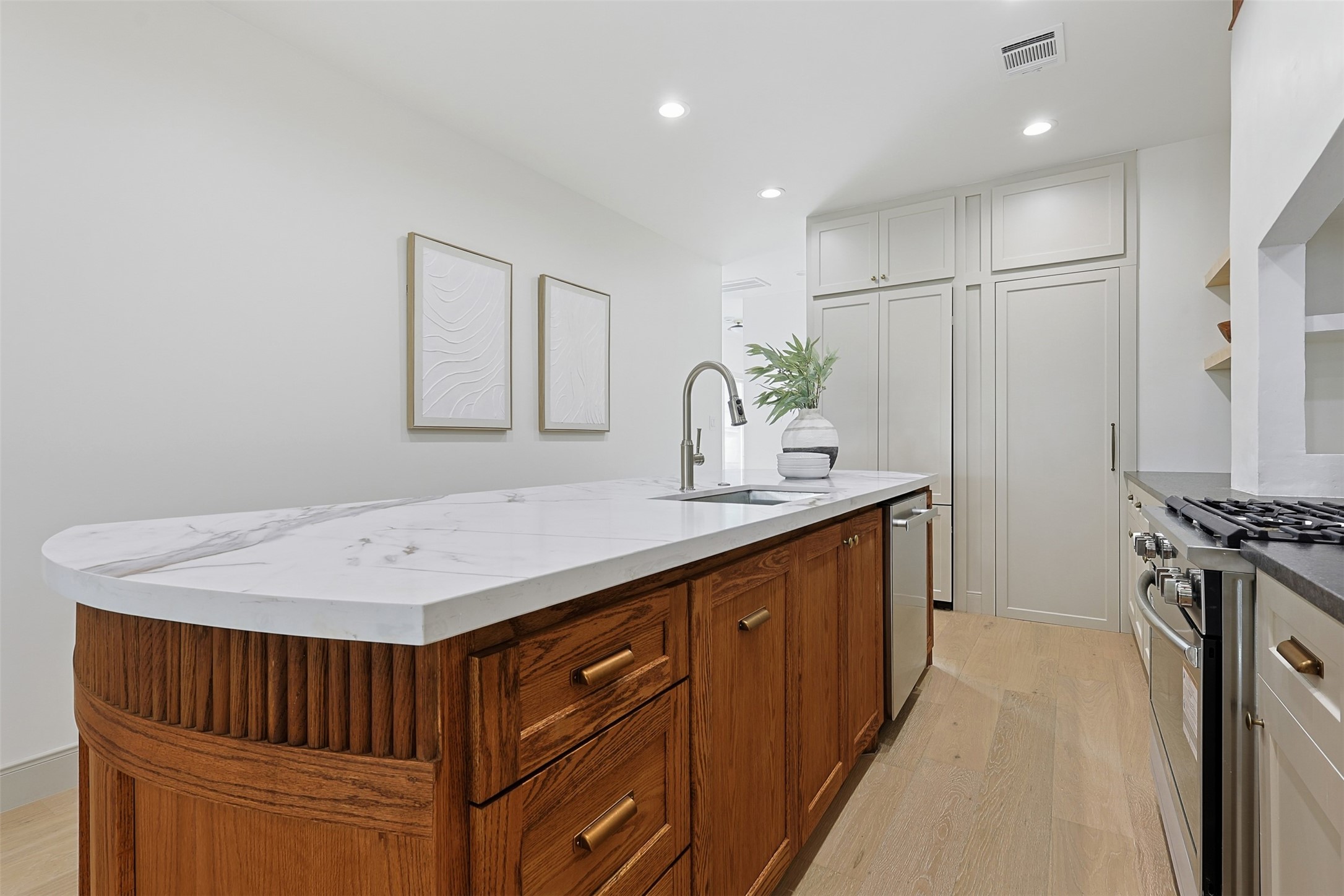 1202 Aurora Street Houston, TX 77009 - Photo 14 of 37 a kitchen with a sink appliances and cabinets
